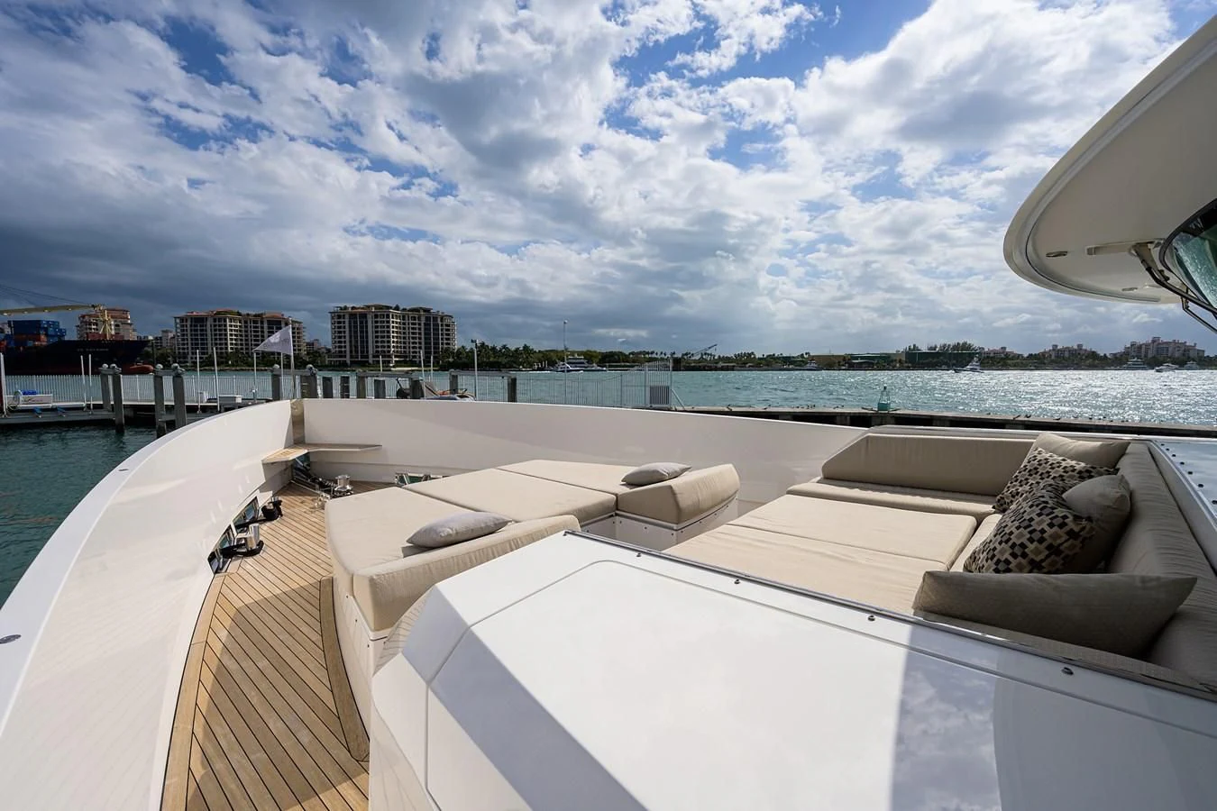 a rooftop of a building with a body of water in the background aboard SOCIAL DISTANCING Yacht for Sale