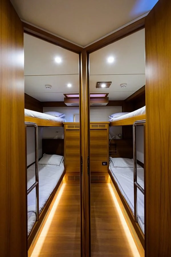 a room with bunk beds aboard SOCIAL DISTANCING Yacht for Sale