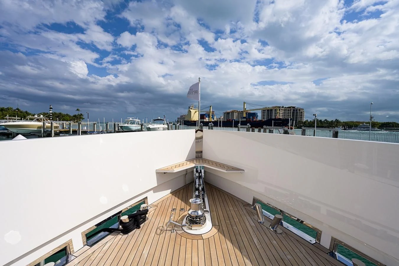 a deck with a railing and a flag on it aboard SOCIAL DISTANCING Yacht for Sale