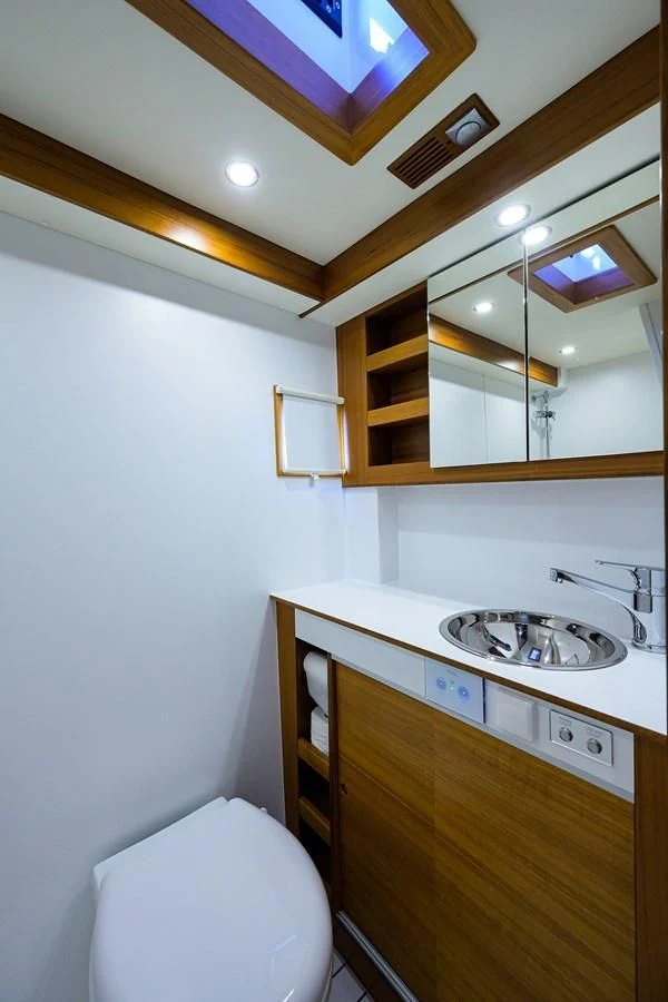 a bathroom with a sink and a mirror aboard SOCIAL DISTANCING Yacht for Sale