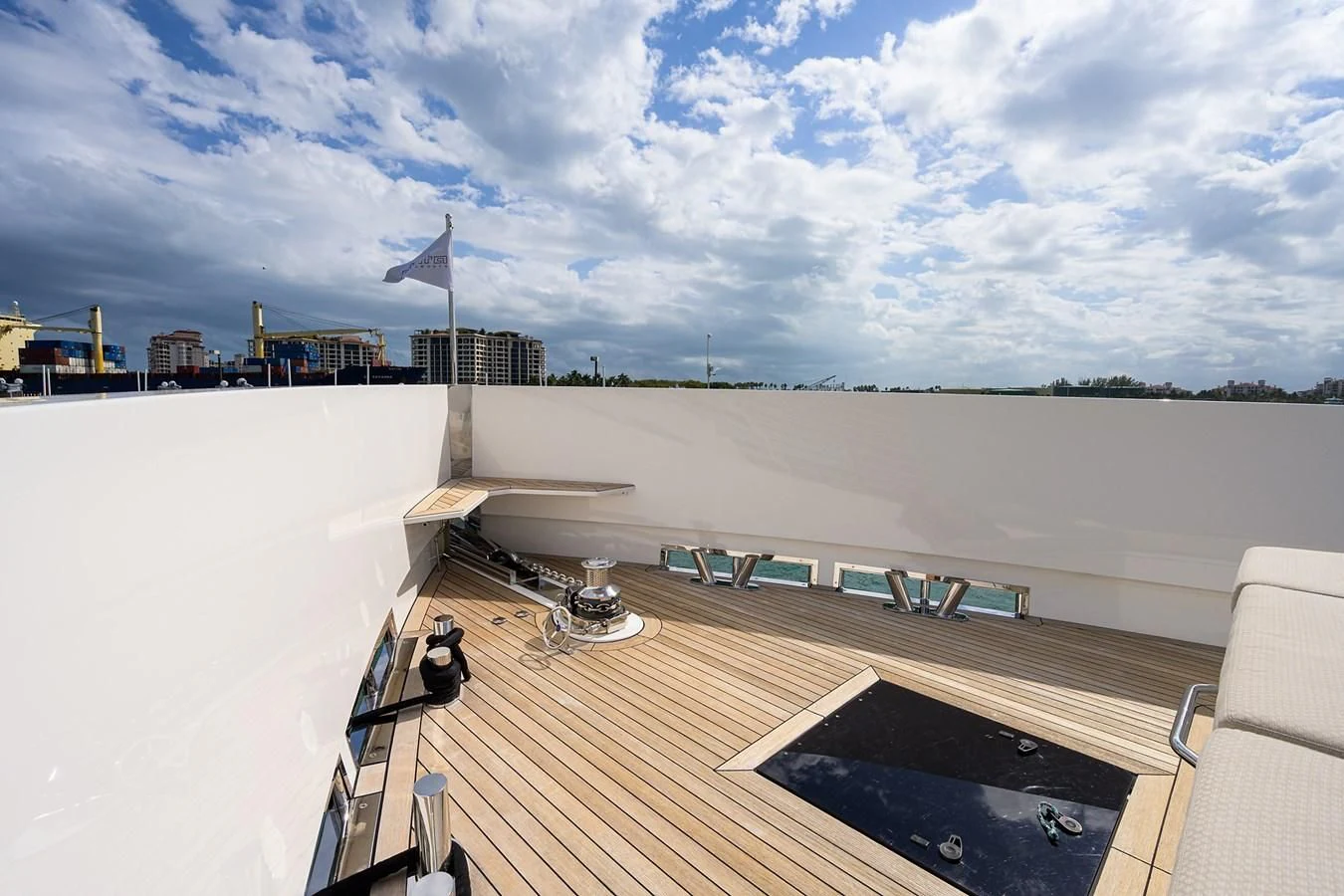 a deck with a deck and a flag on it aboard SOCIAL DISTANCING Yacht for Sale
