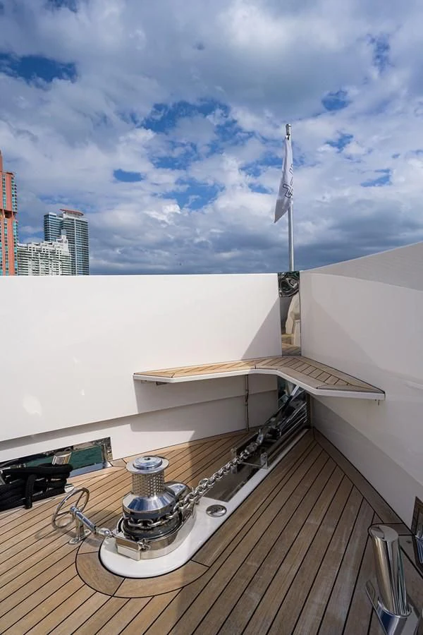 a large white building with a satellite dish on a wooden deck aboard SOCIAL DISTANCING Yacht for Sale