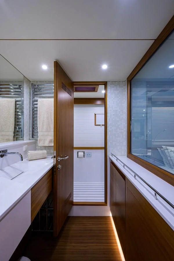 a bathroom with a sink and a mirror aboard SOCIAL DISTANCING Yacht for Sale