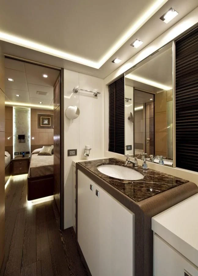 a bathroom with a sink and a mirror aboard MUSA Yacht for Sale