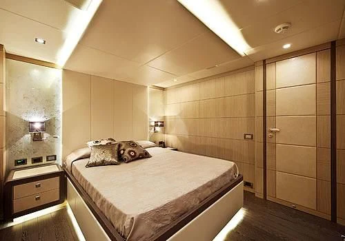 a large bathroom with a large bed aboard MUSA Yacht for Sale