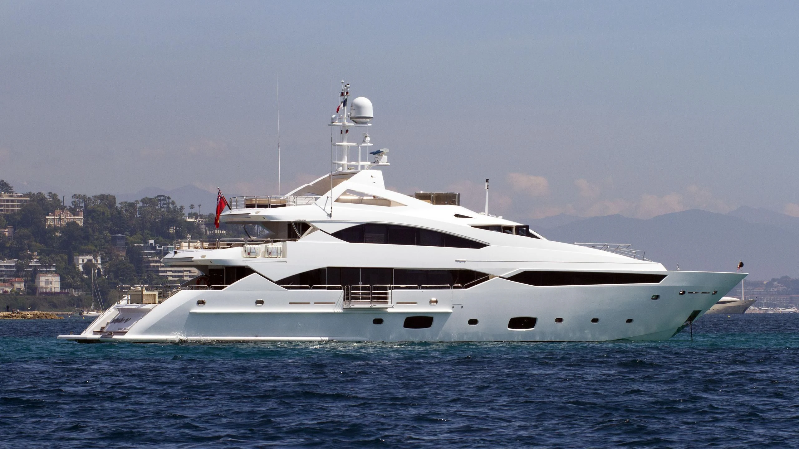 a white yacht in the water aboard SEA RAIDER V Yacht for Sale