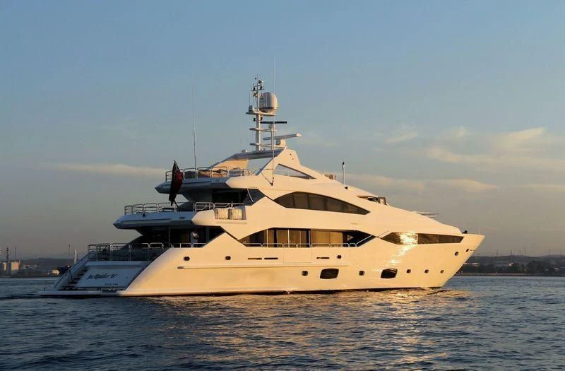a large white boat on the water aboard SEA RAIDER V Yacht for Sale