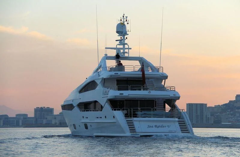 a large ship in the water aboard SEA RAIDER V Yacht for Sale