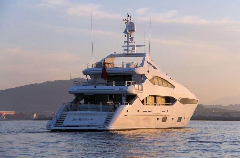 a large white ship in the water aboard SEA RAIDER V Yacht for Sale