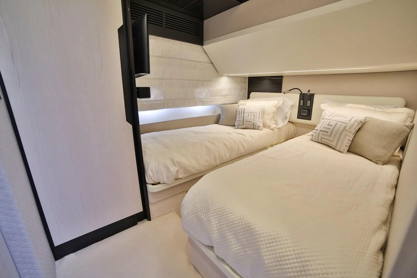 a room with a bed and a television aboard SIRONA JOANNAH Yacht for Sale