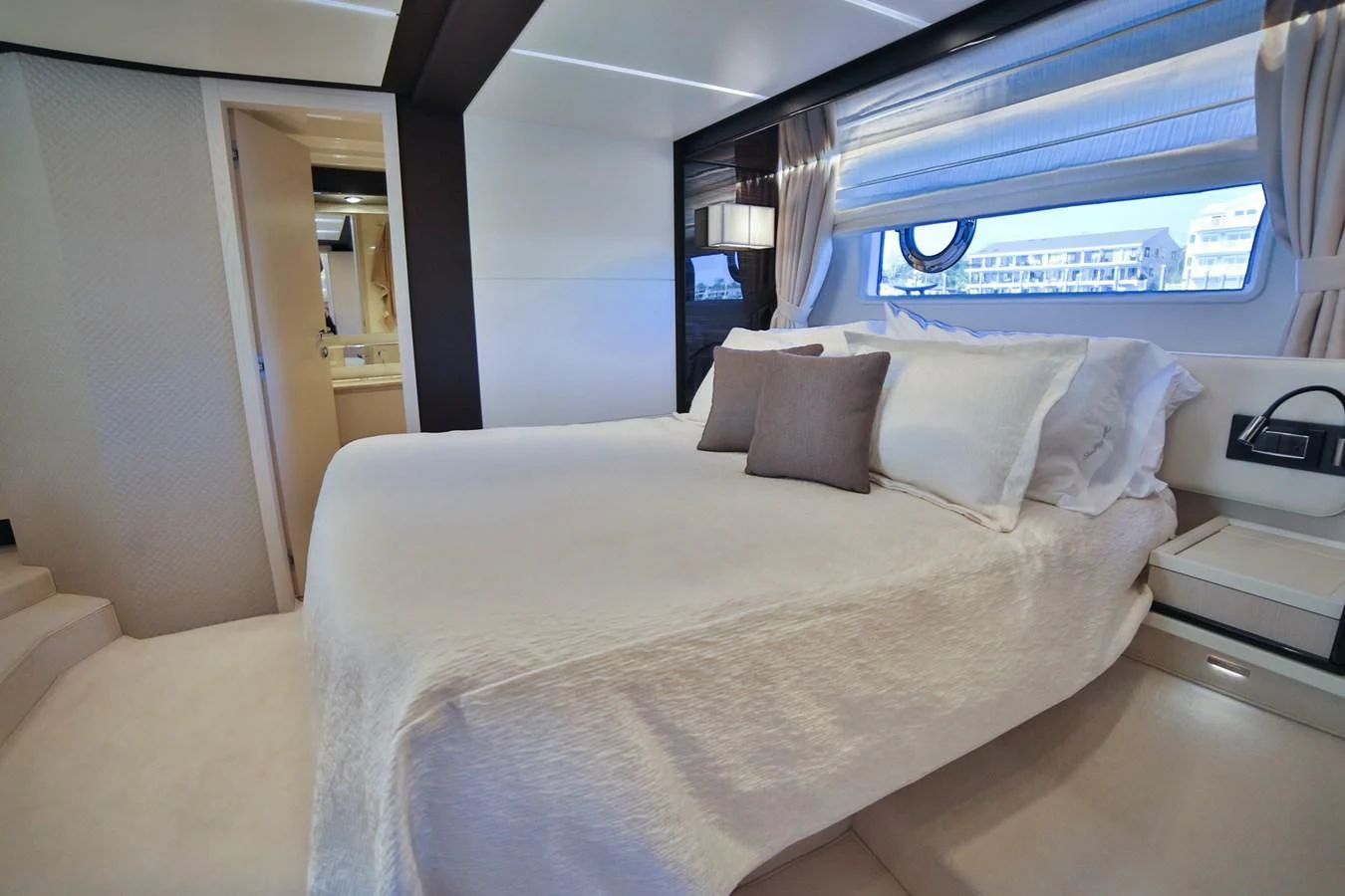 a bed with a white sheet aboard SIRONA JOANNAH Yacht for Sale