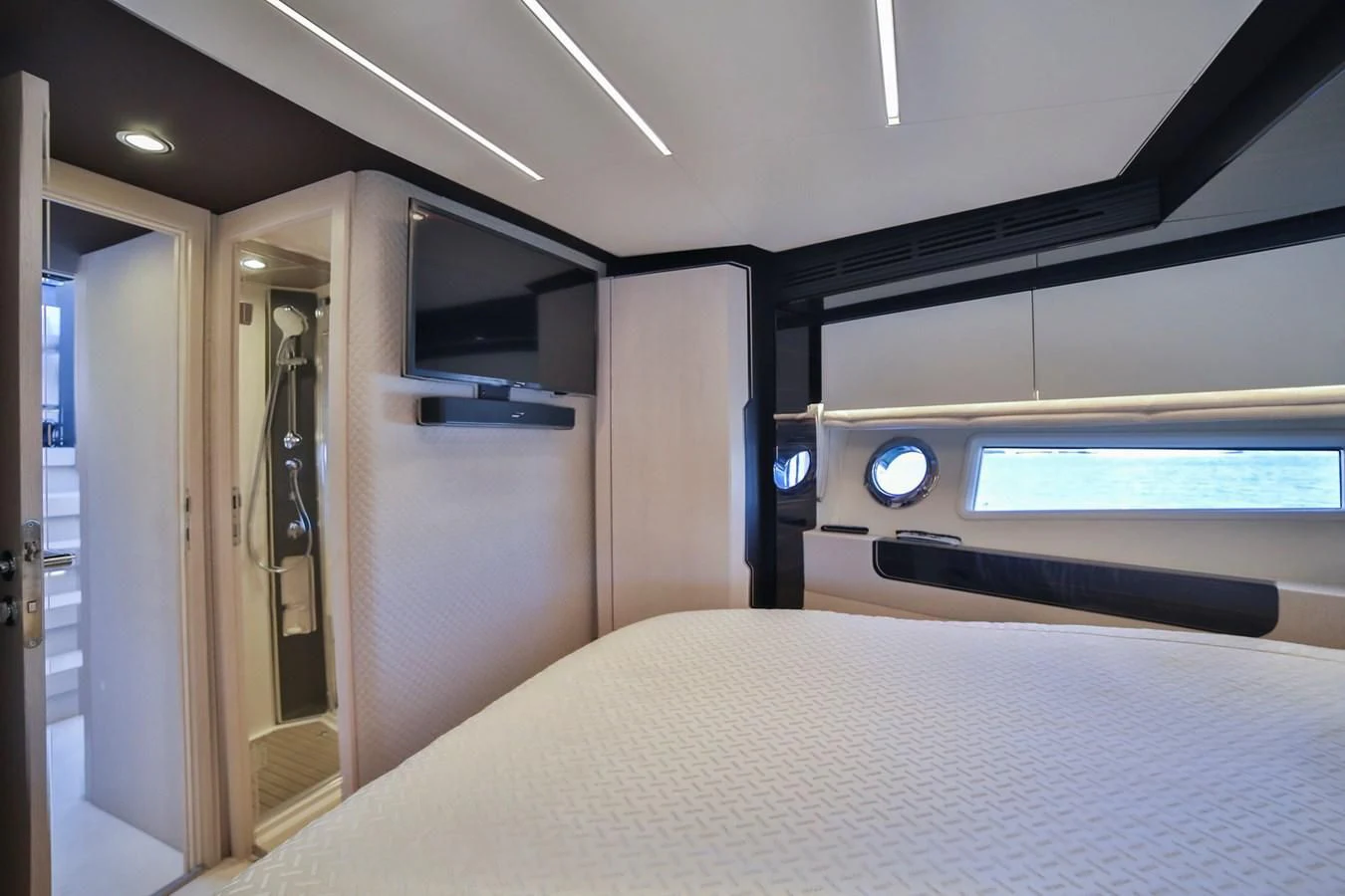 a room with a bed and a window aboard SIRONA JOANNAH Yacht for Sale