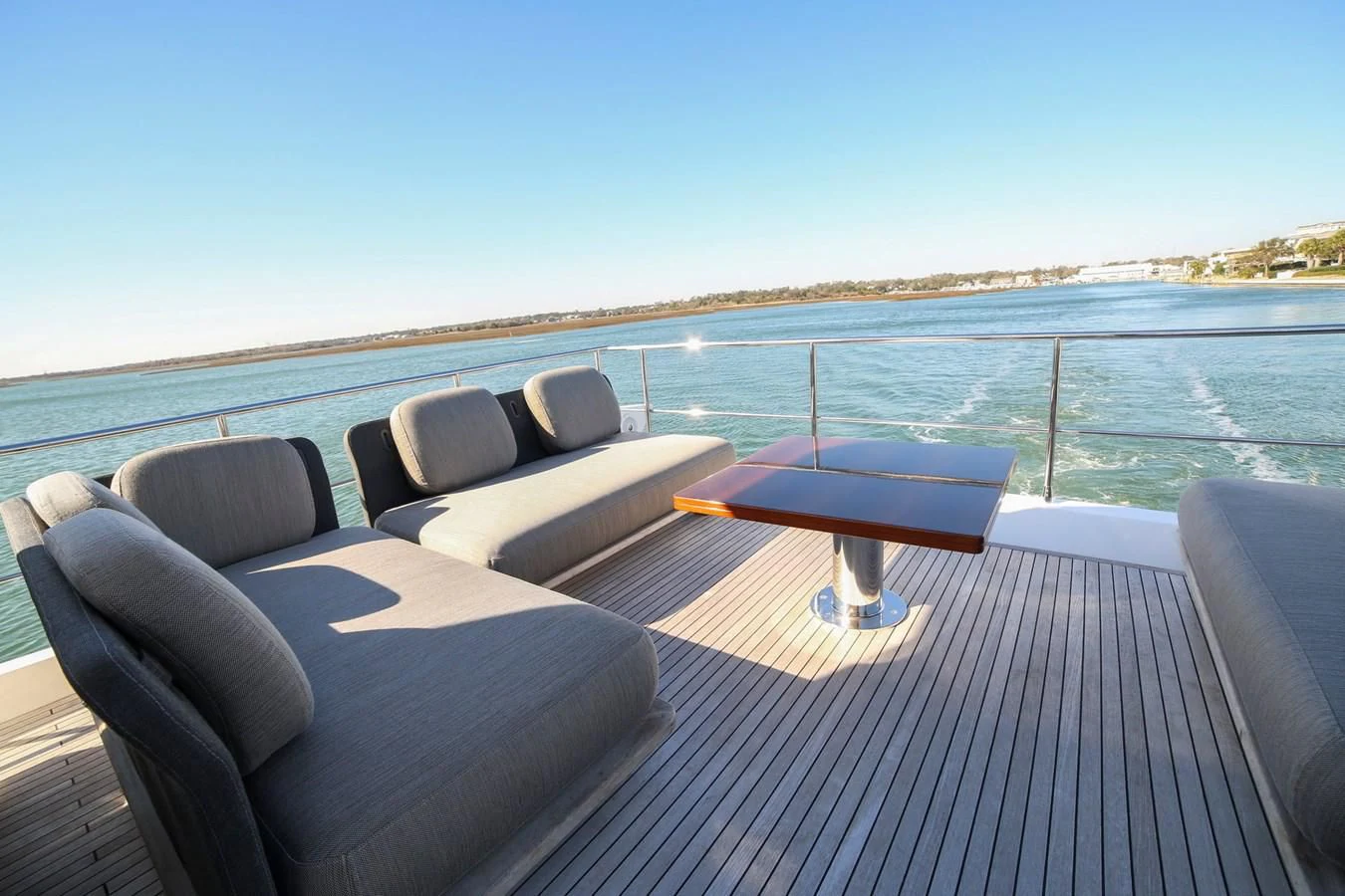 a deck with a view of the water and a beach aboard SIRONA JOANNAH Yacht for Sale