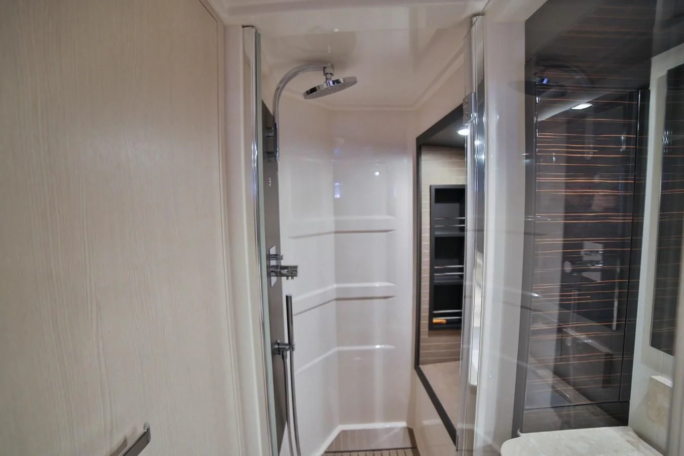 a bathroom with a glass shower aboard SIRONA JOANNAH Yacht for Sale