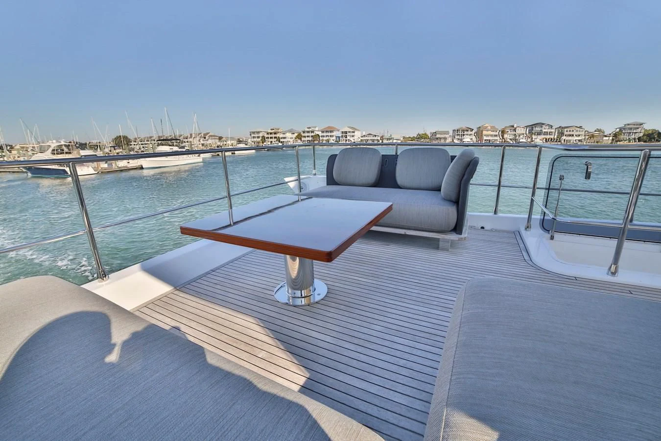 a chair on a deck overlooking a city aboard SIRONA JOANNAH Yacht for Sale