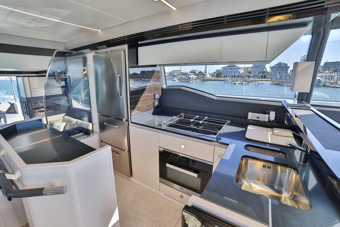 a kitchen with a large window aboard SIRONA JOANNAH Yacht for Sale