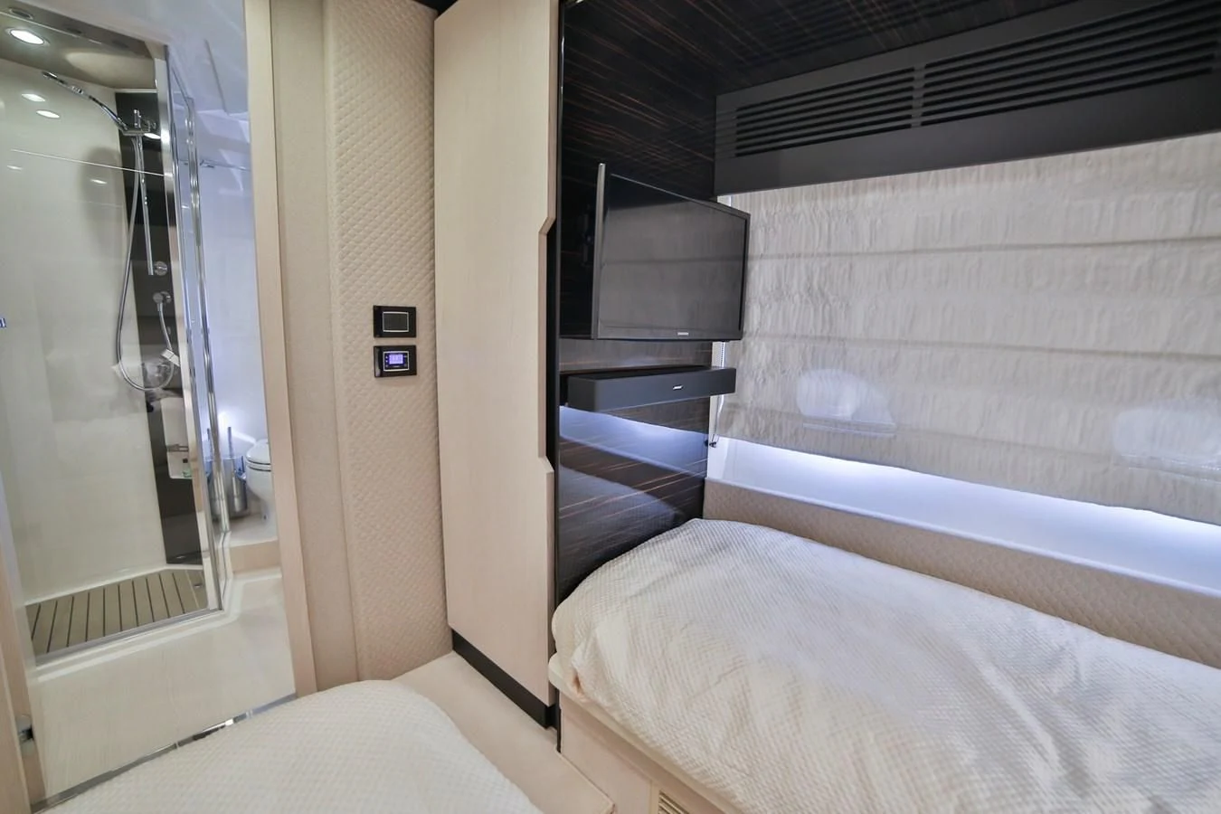 a room with a bed and a door aboard SIRONA JOANNAH Yacht for Sale