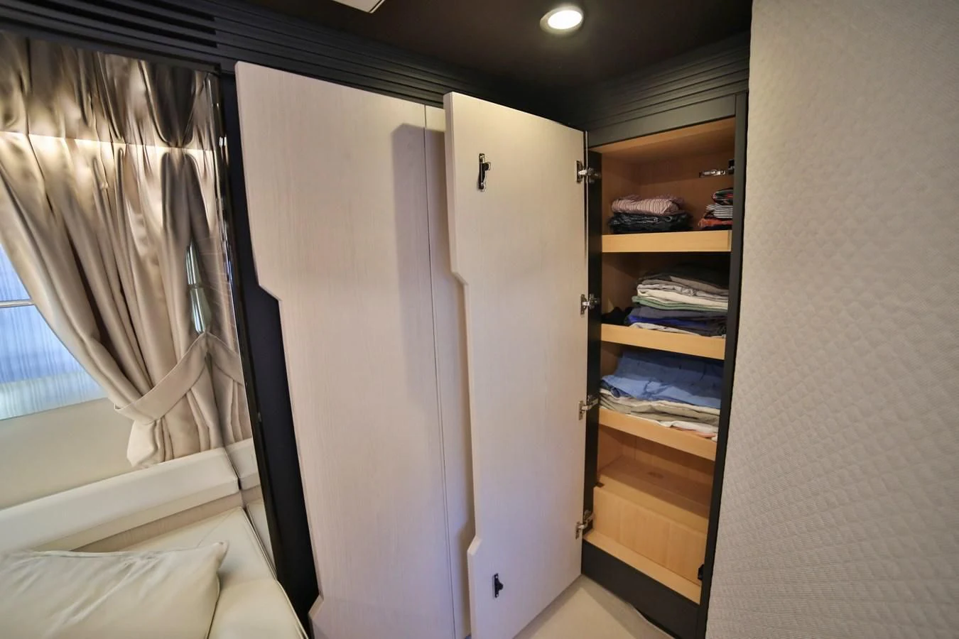 a room with a closet and a bed aboard SIRONA JOANNAH Yacht for Sale