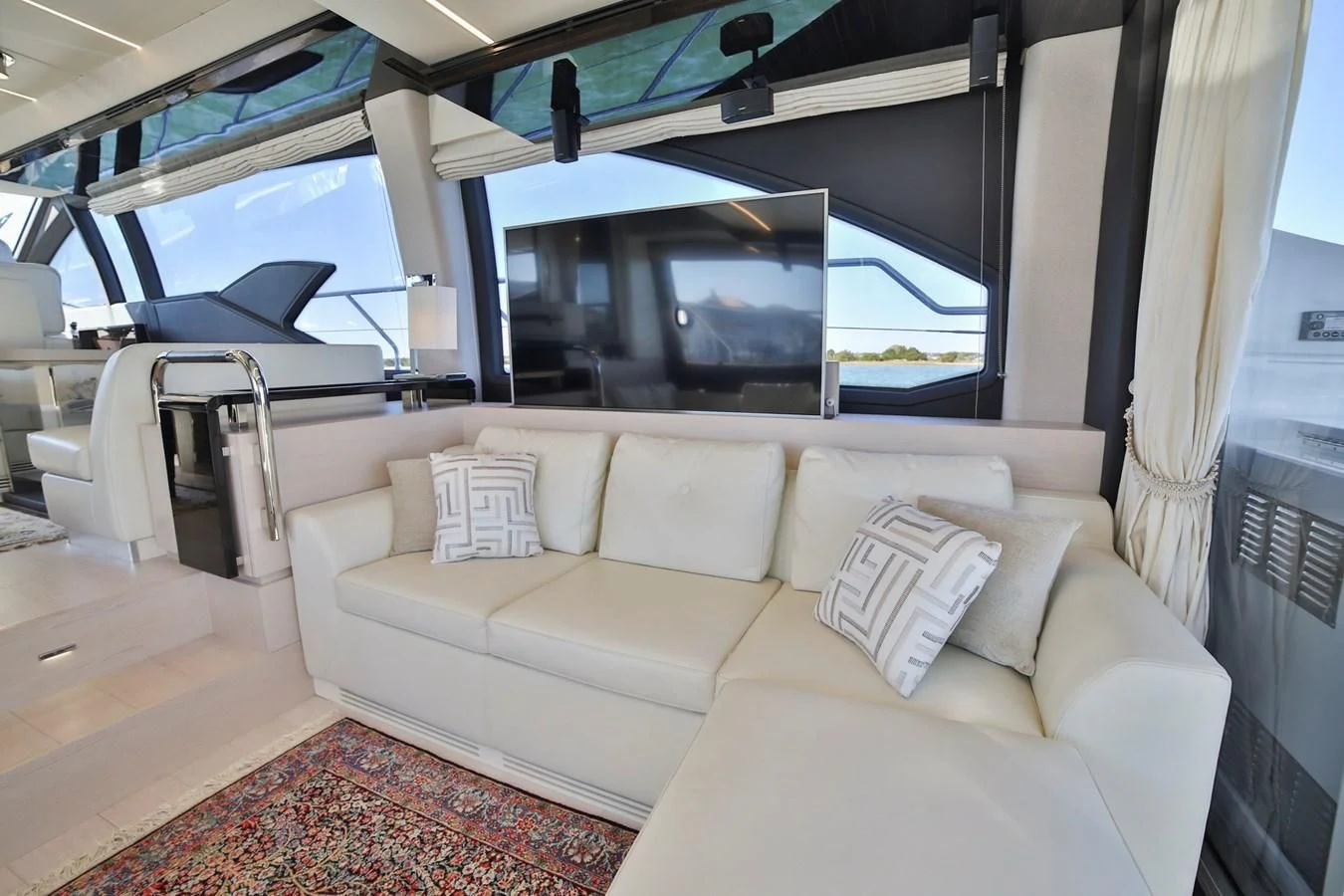 a living room with a large window aboard SIRONA JOANNAH Yacht for Sale