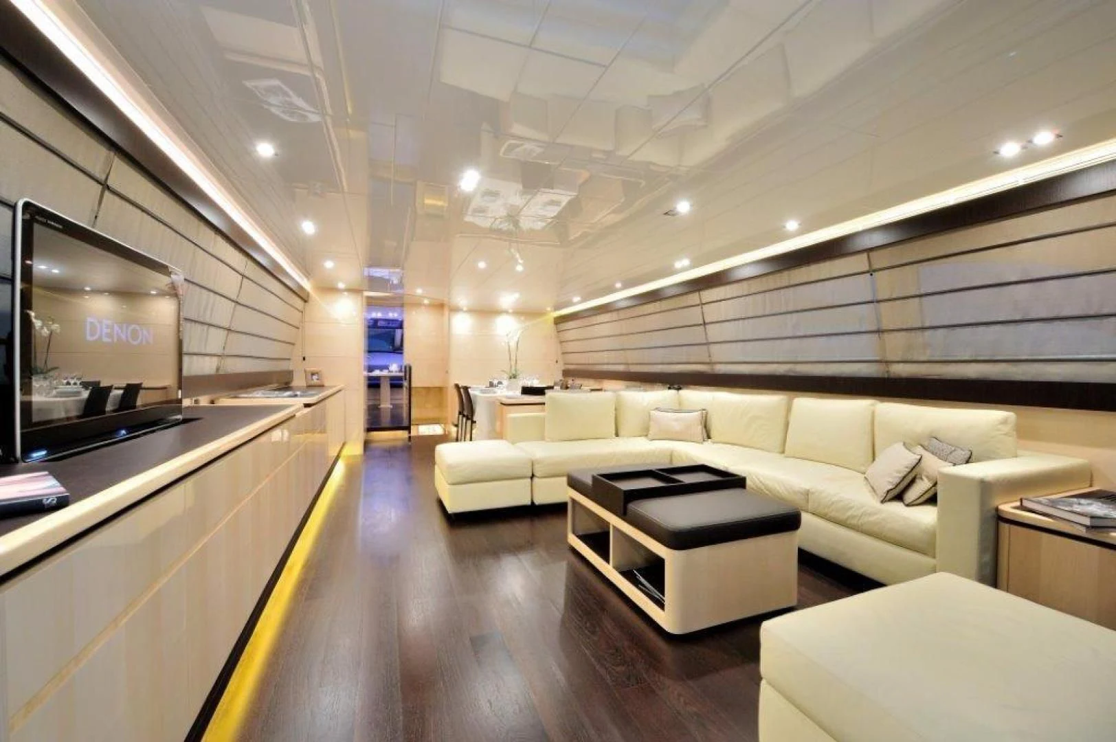 a room with a couch and a table aboard ELLISIUM Yacht for Sale