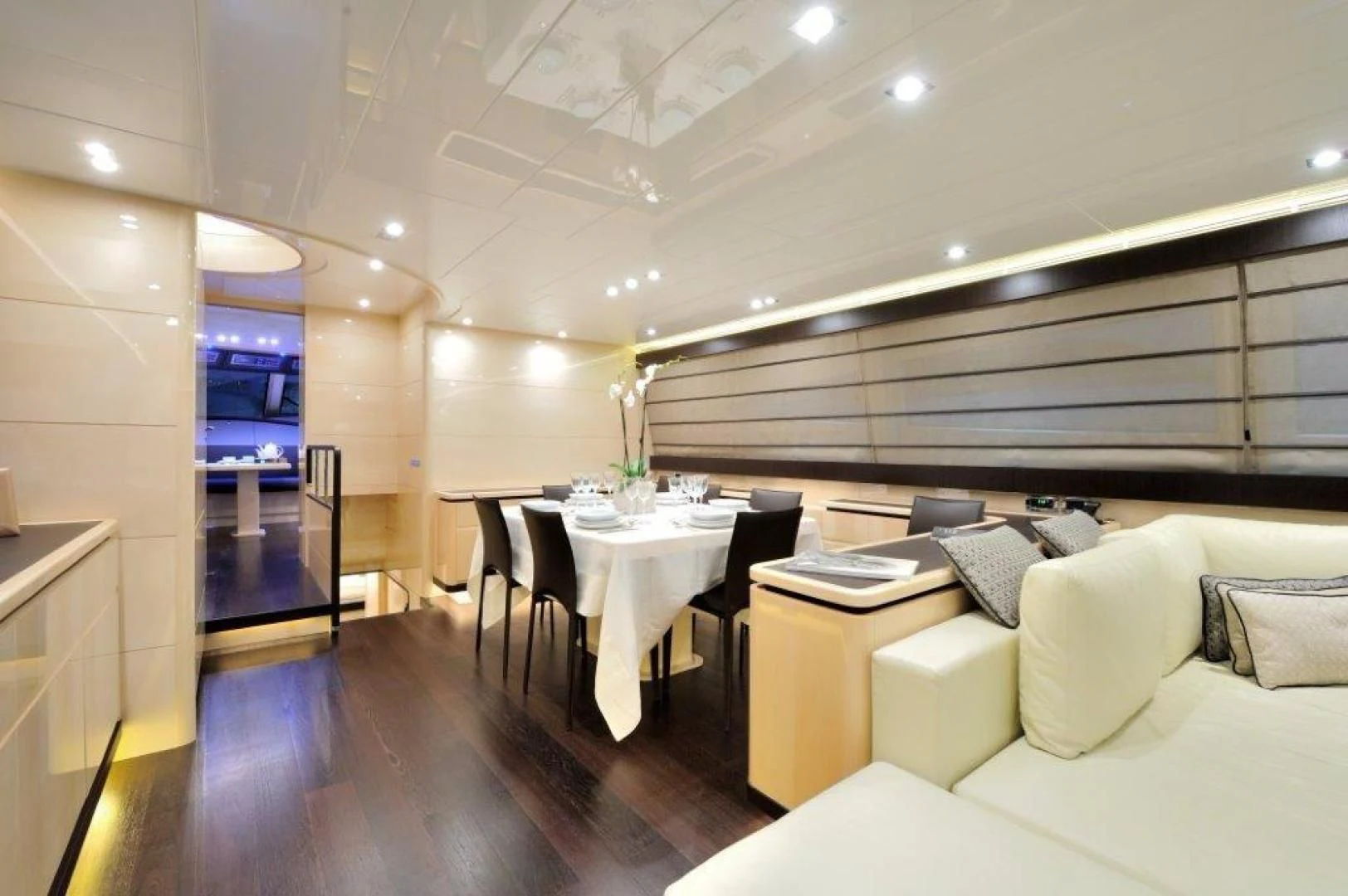 a room with a table and chairs aboard ELLISIUM Yacht for Sale