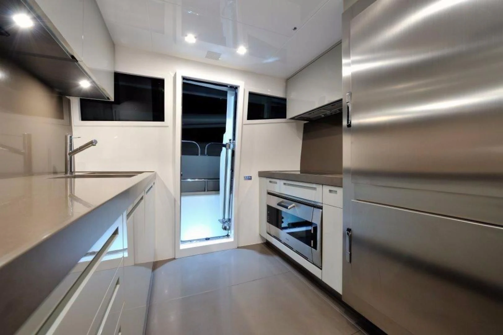 a kitchen with a large window aboard ELLISIUM Yacht for Sale