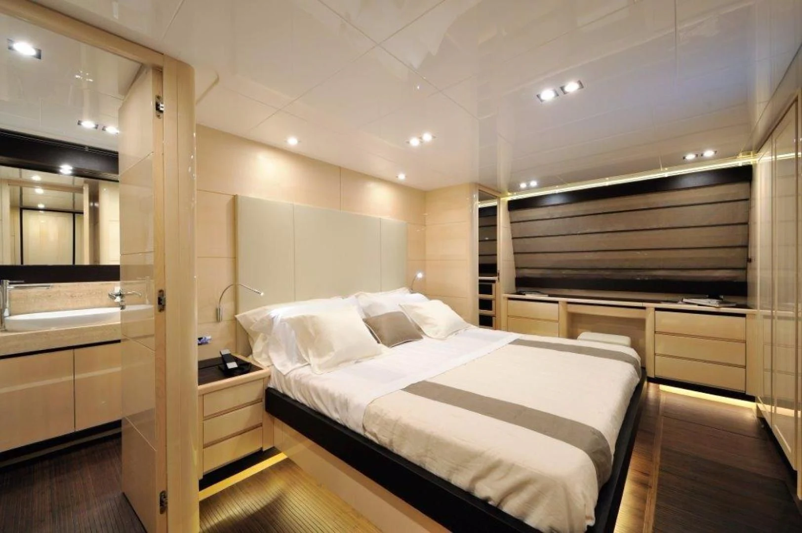 a room with a bed and a desk aboard ELLISIUM Yacht for Sale