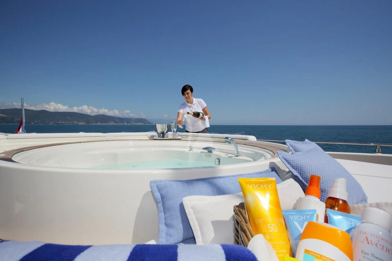 a person sitting in a bathtub aboard VELA Yacht for Sale