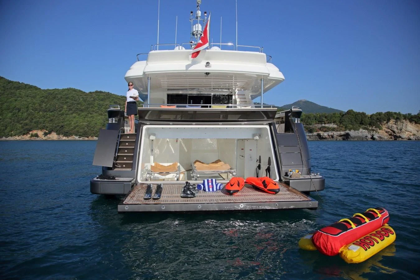 a boat with a person on it aboard VELA Yacht for Sale