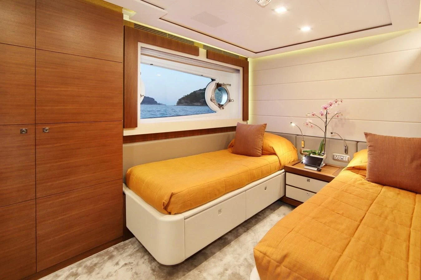 a room with a bed and a tv aboard VELA Yacht for Sale