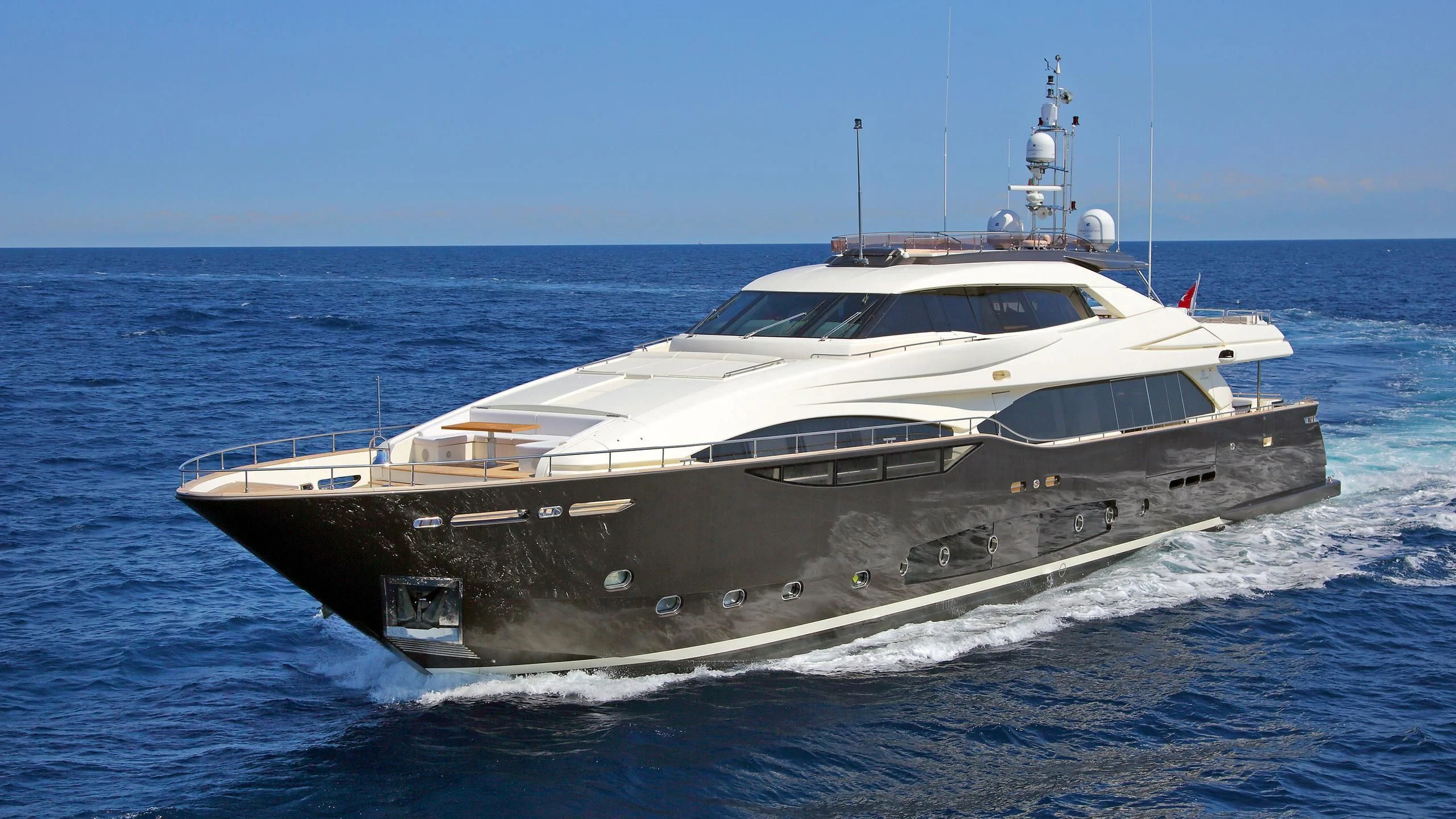 a white yacht on the water aboard VELA Yacht for Sale