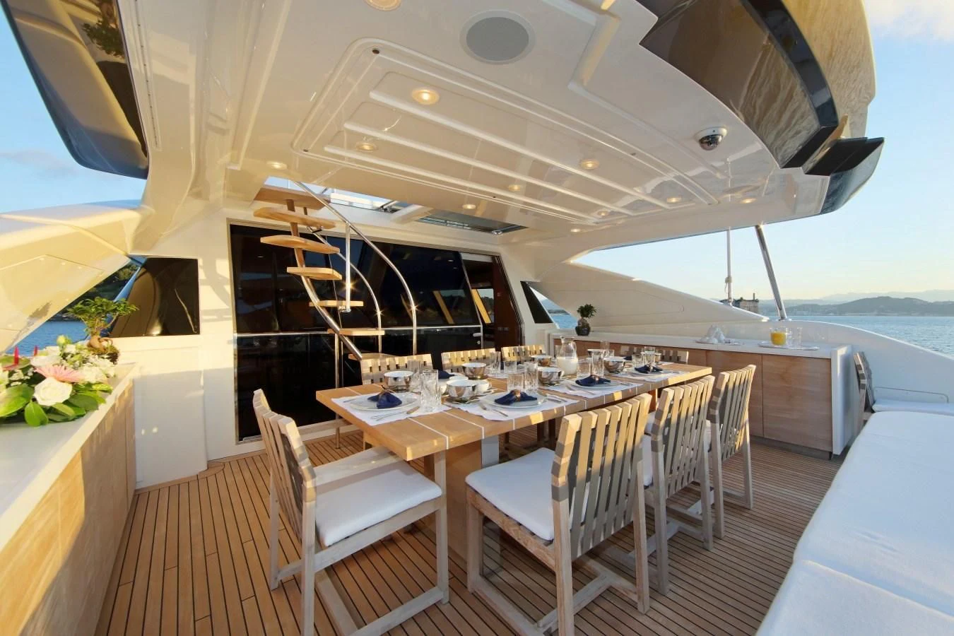 a table and chairs on a boat aboard VELA Yacht for Sale