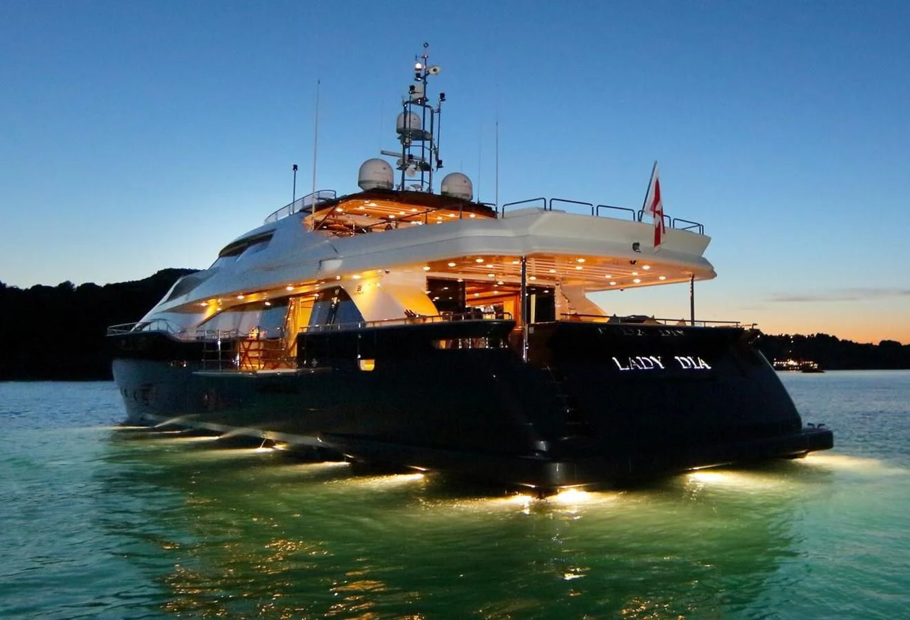 a large ship in the water aboard VELA Yacht for Sale