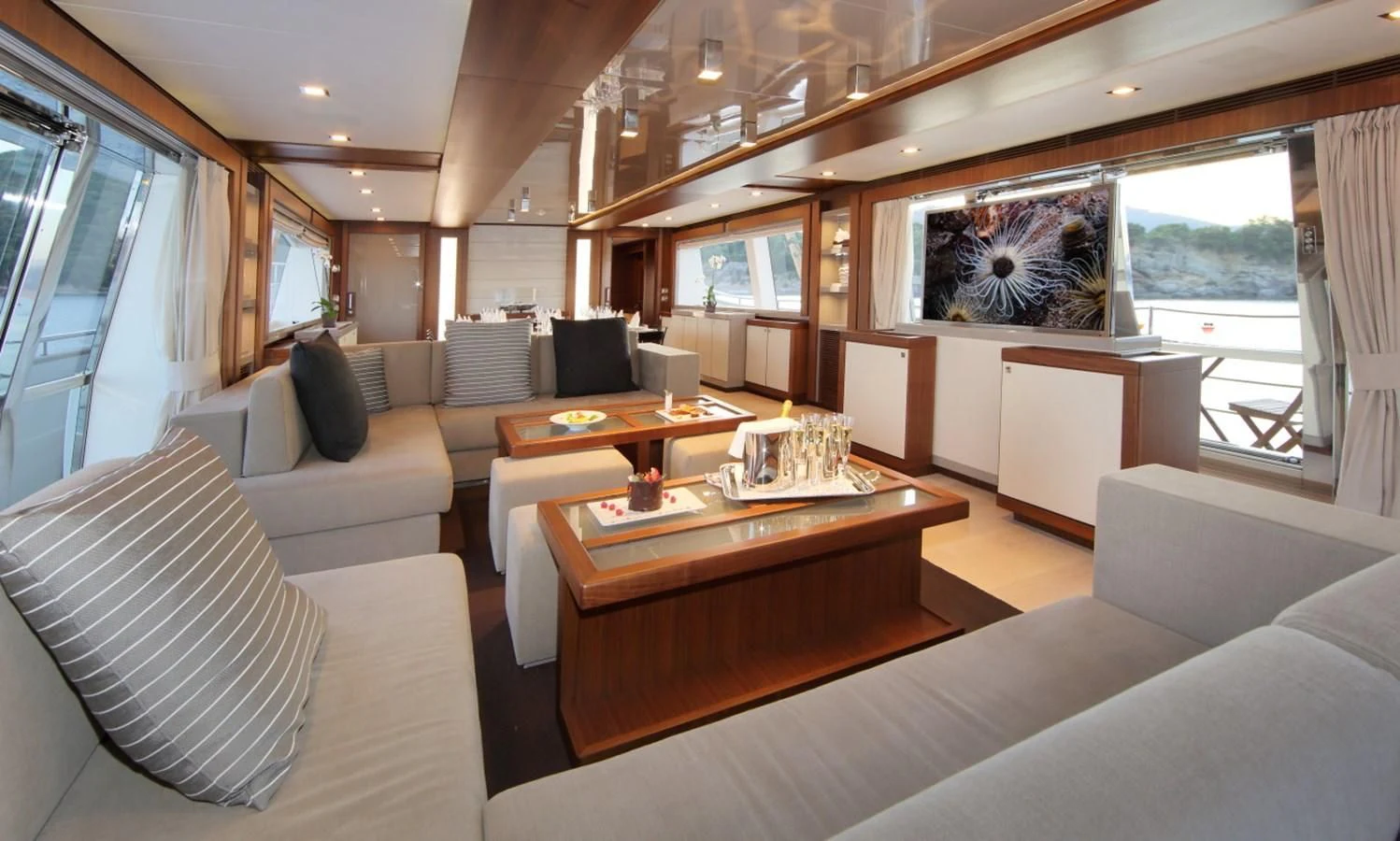 a living room with a large window aboard VELA Yacht for Sale