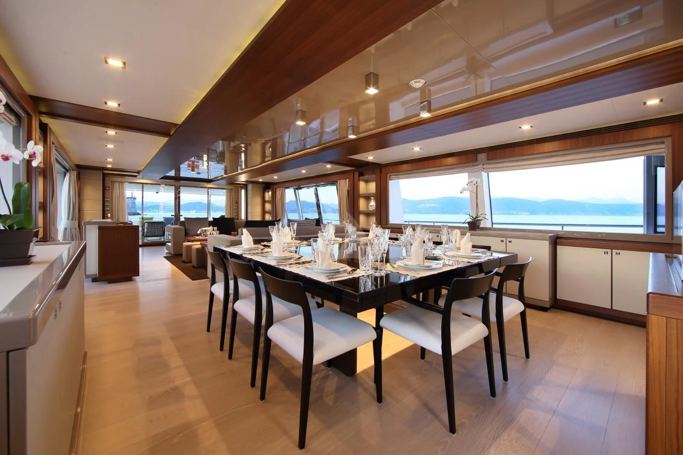 a large dining table in a kitchen aboard VELA Yacht for Sale