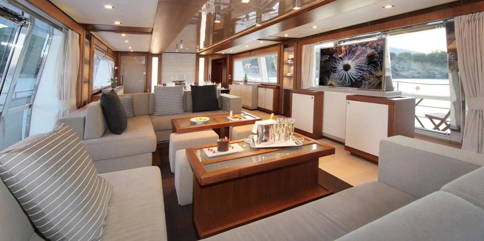 a living room with a large window aboard VELA Yacht for Sale