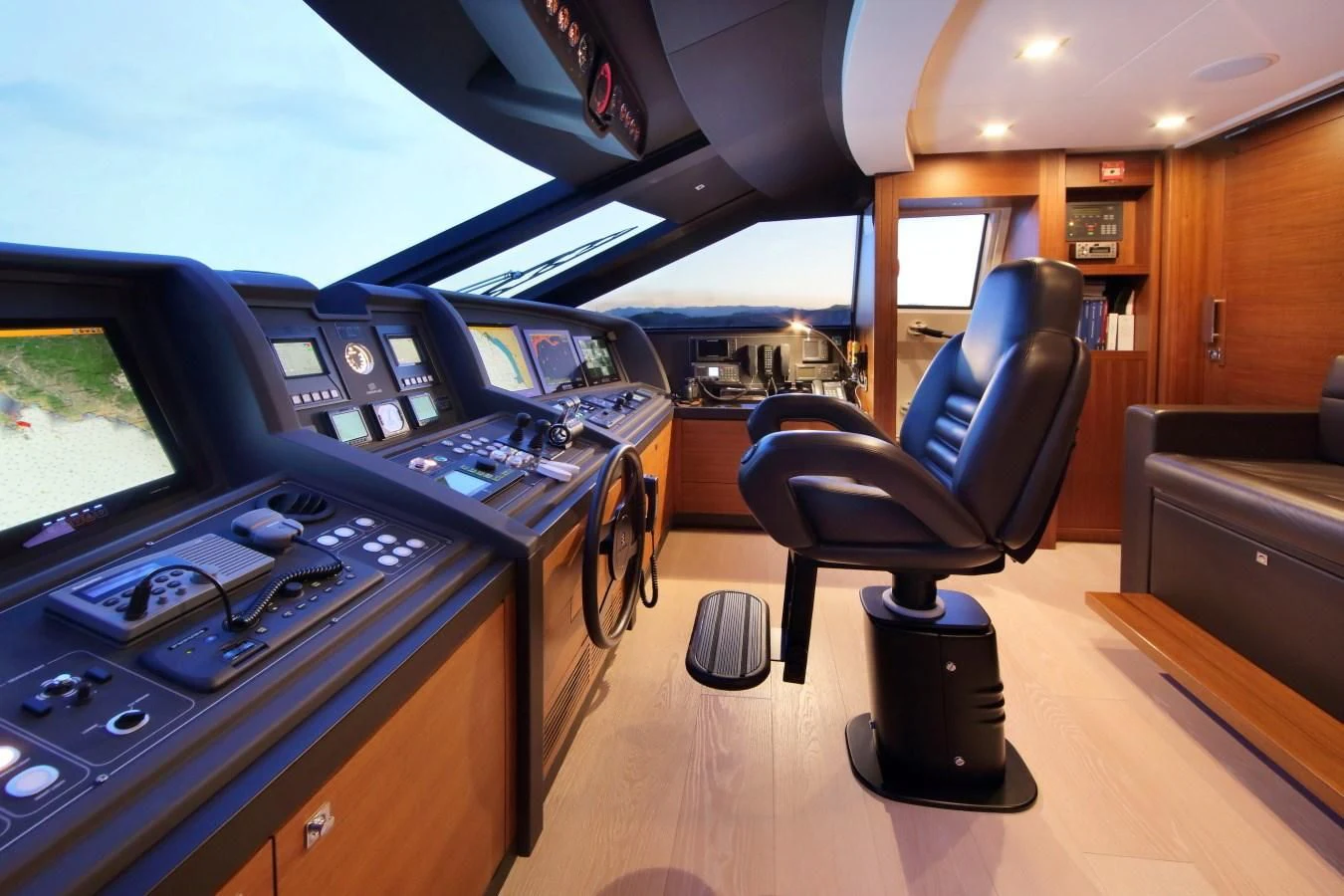 a room with a row of computers aboard VELA Yacht for Sale