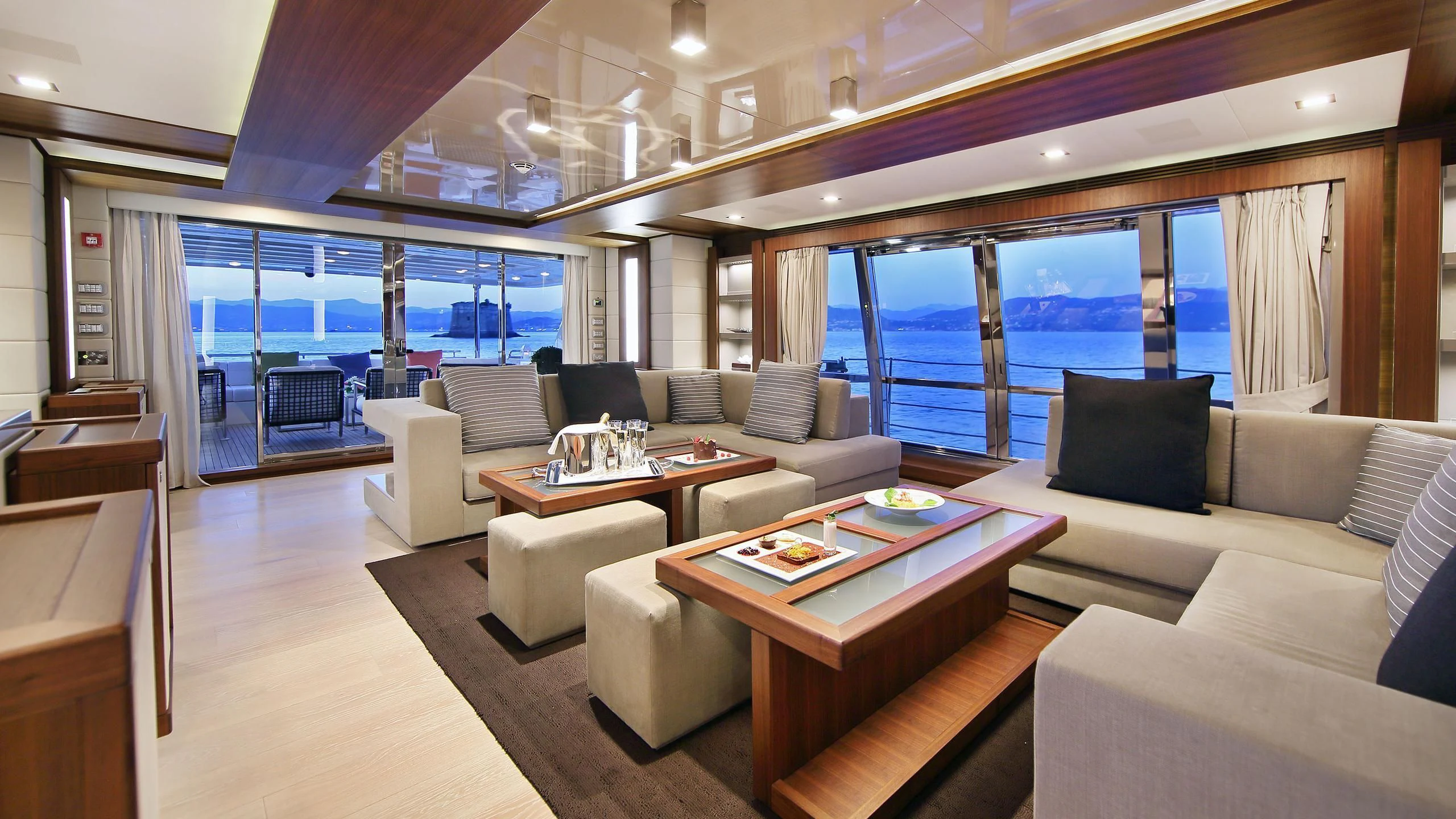 a living room with a large window aboard VELA Yacht for Sale