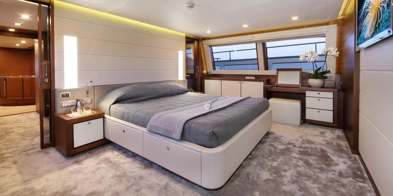 a bedroom with a large bed aboard VELA Yacht for Sale