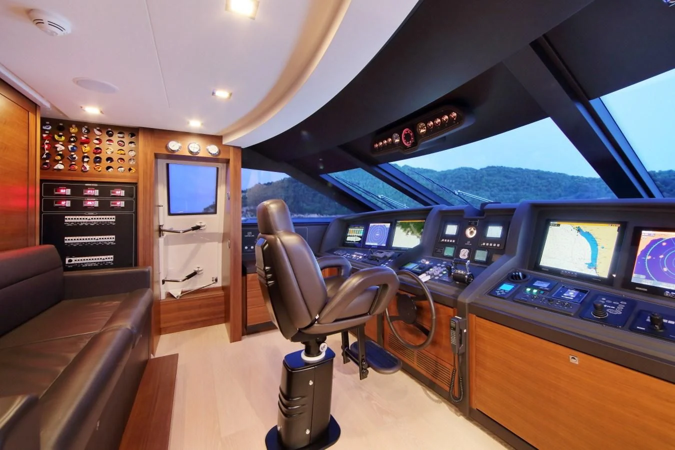 inside of a vehicle with a desk and chairs and a television aboard VELA Yacht for Sale