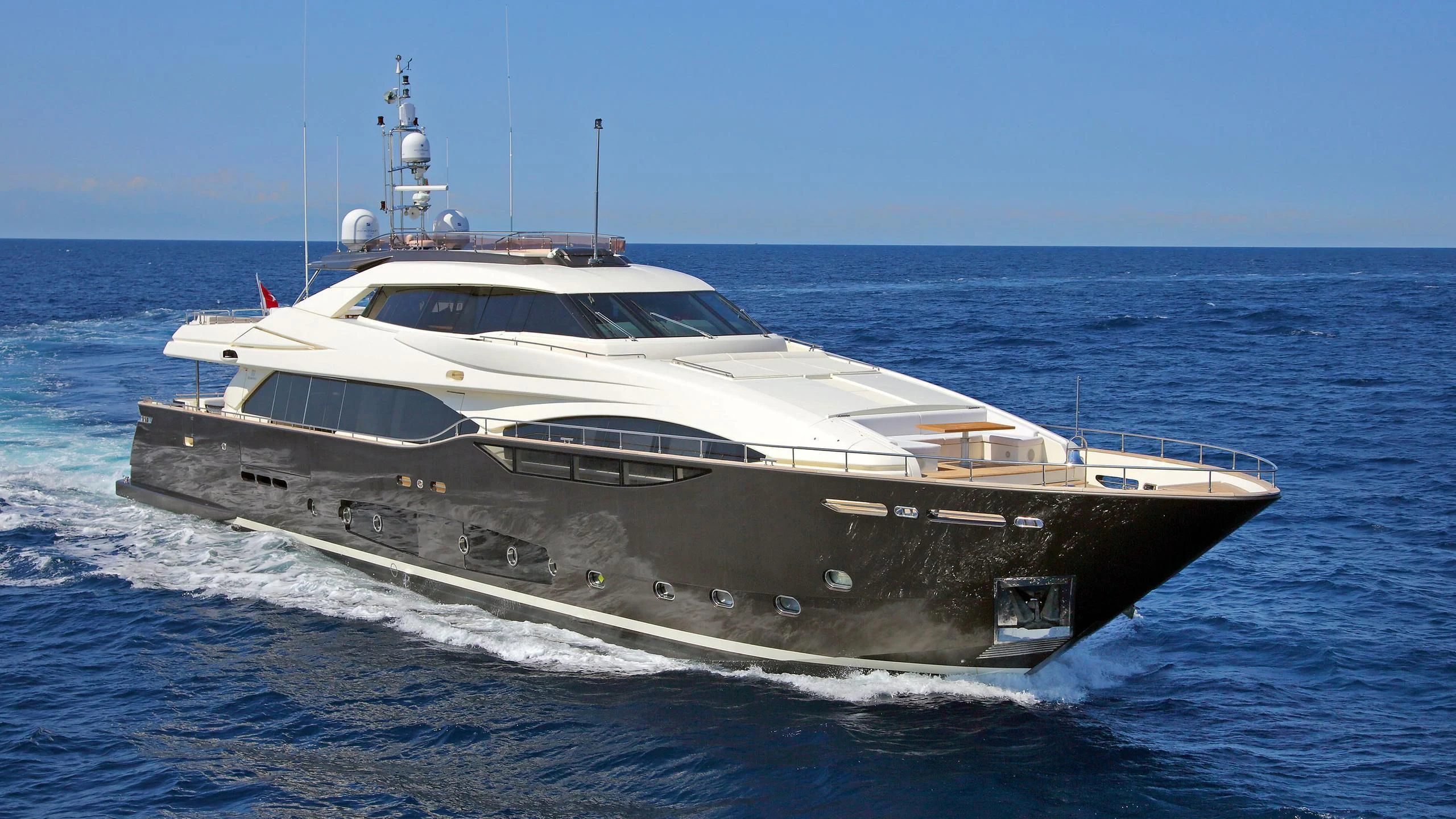 a white yacht in the water aboard VELA Yacht for Sale