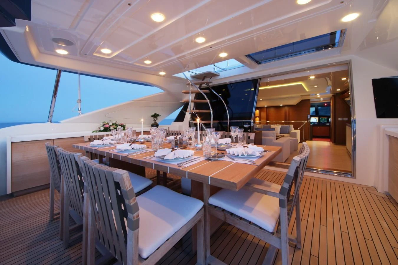 a dining room with a table and chairs aboard VELA Yacht for Sale
