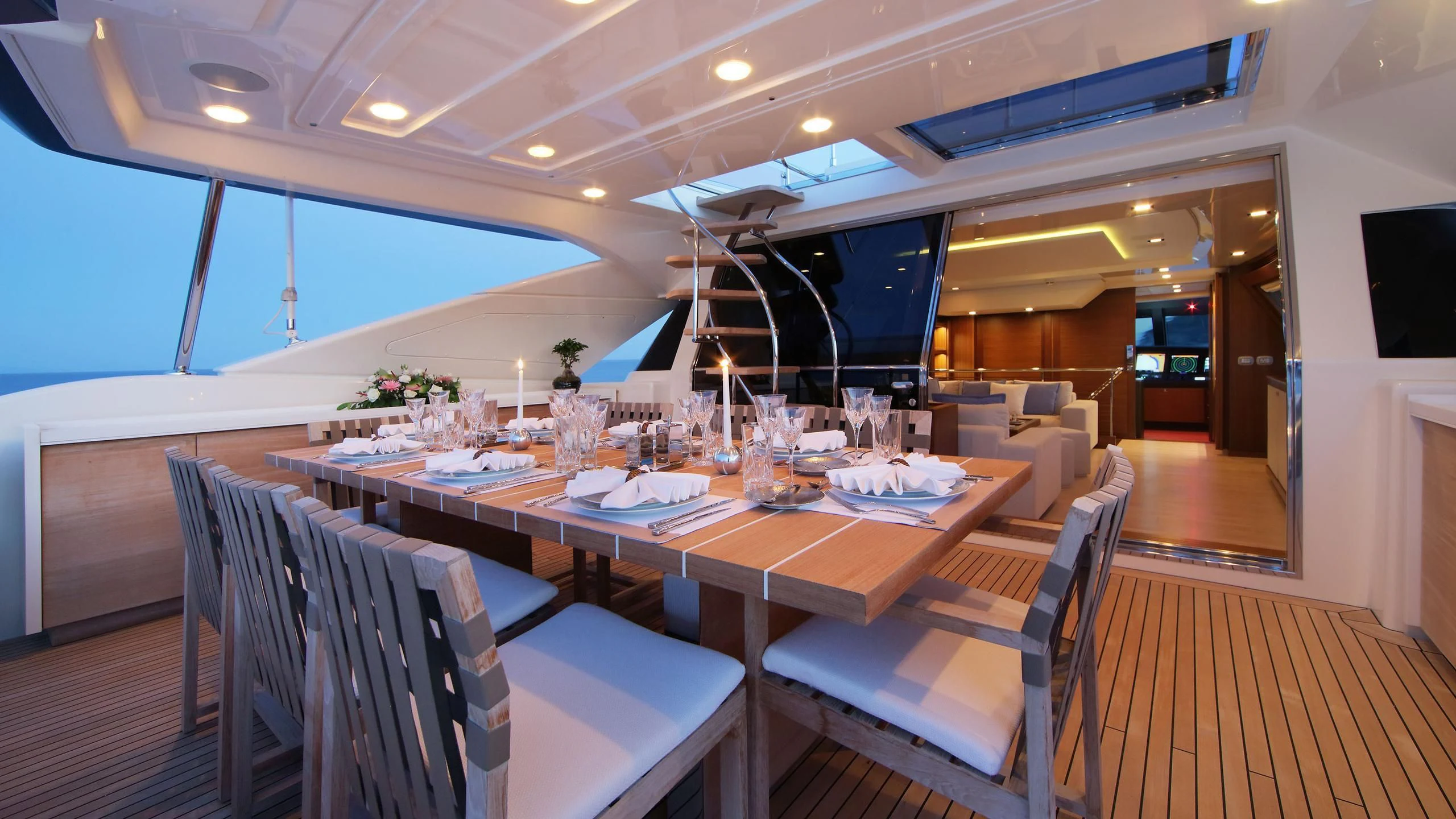 a table set for a dinner party aboard VELA Yacht for Sale