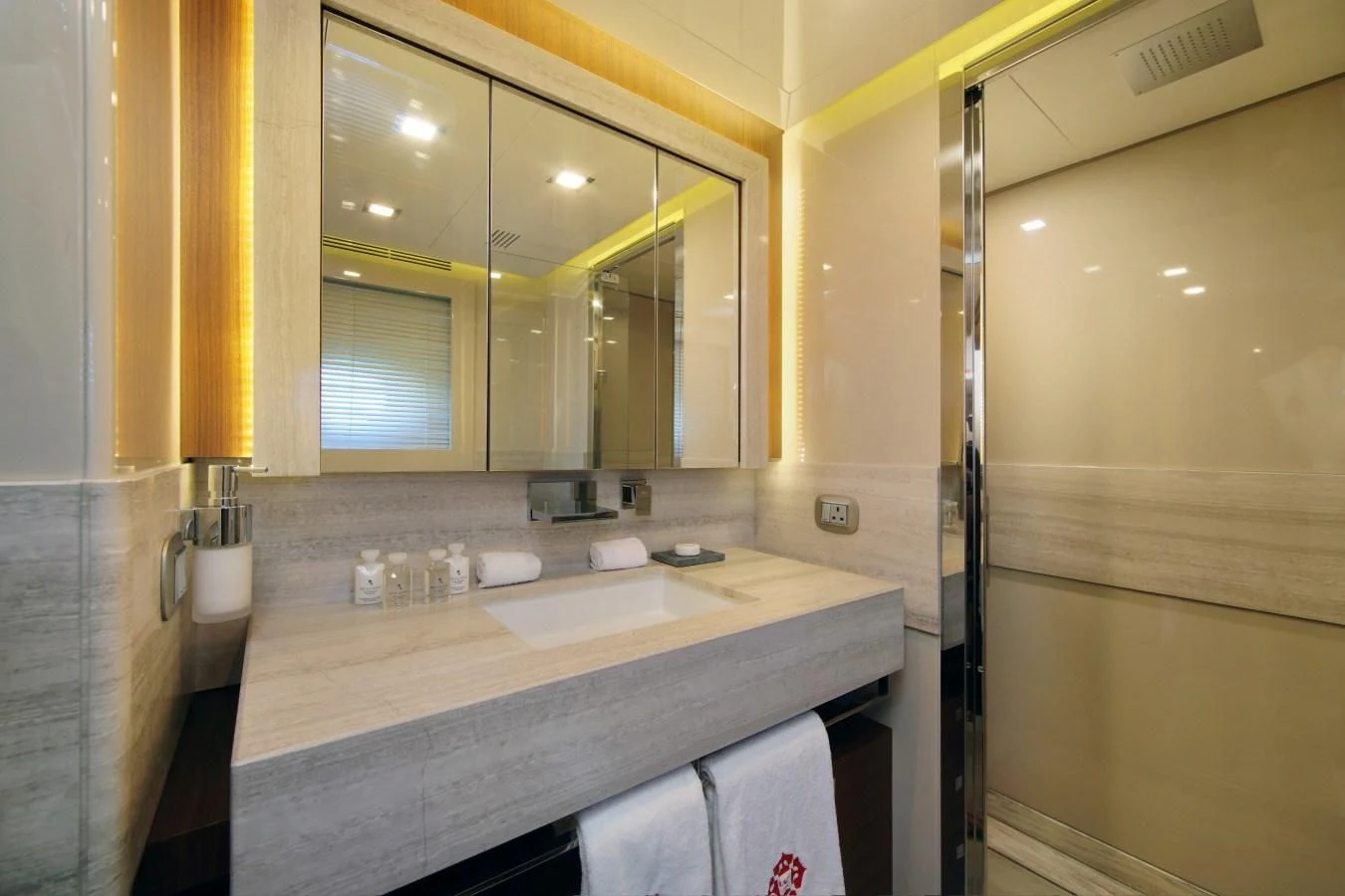 a bathroom with a large mirror aboard VELA Yacht for Sale