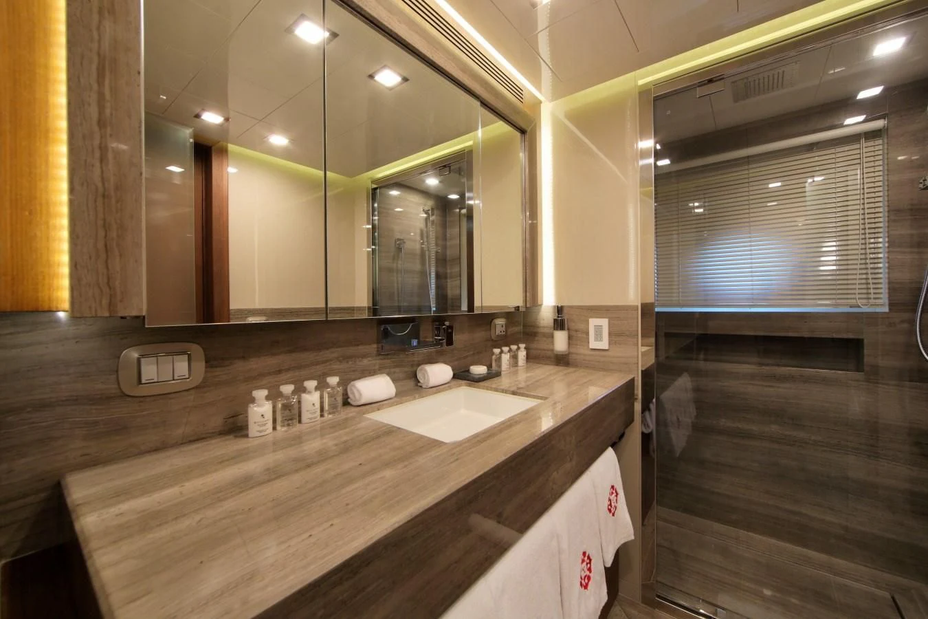 a bathroom with a large mirror aboard VELA Yacht for Sale