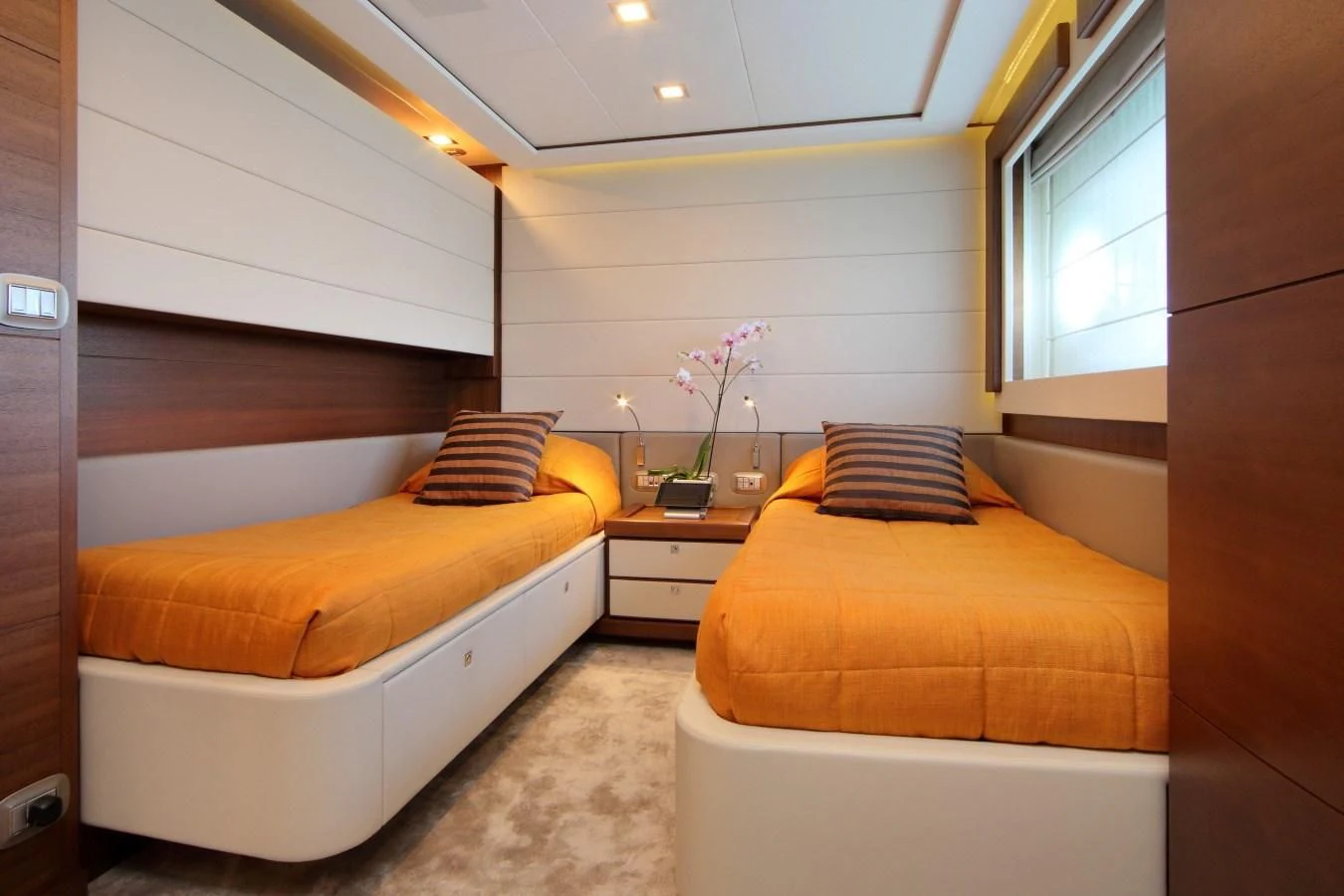 a room with two beds aboard VELA Yacht for Sale