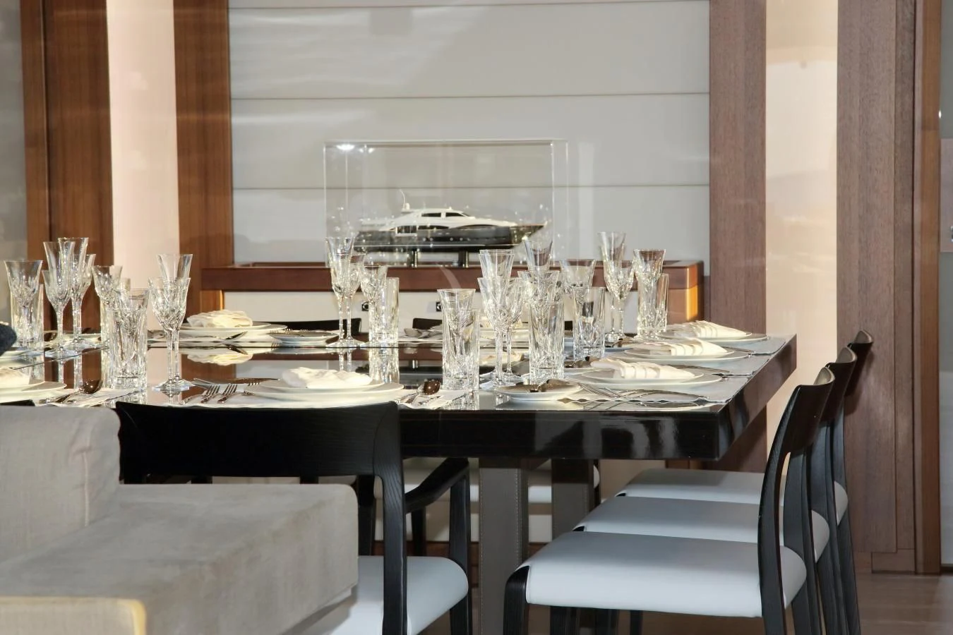 a table set for a dinner aboard VELA Yacht for Sale