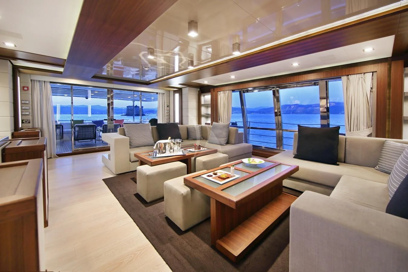 a living room with a large window aboard VELA Yacht for Sale