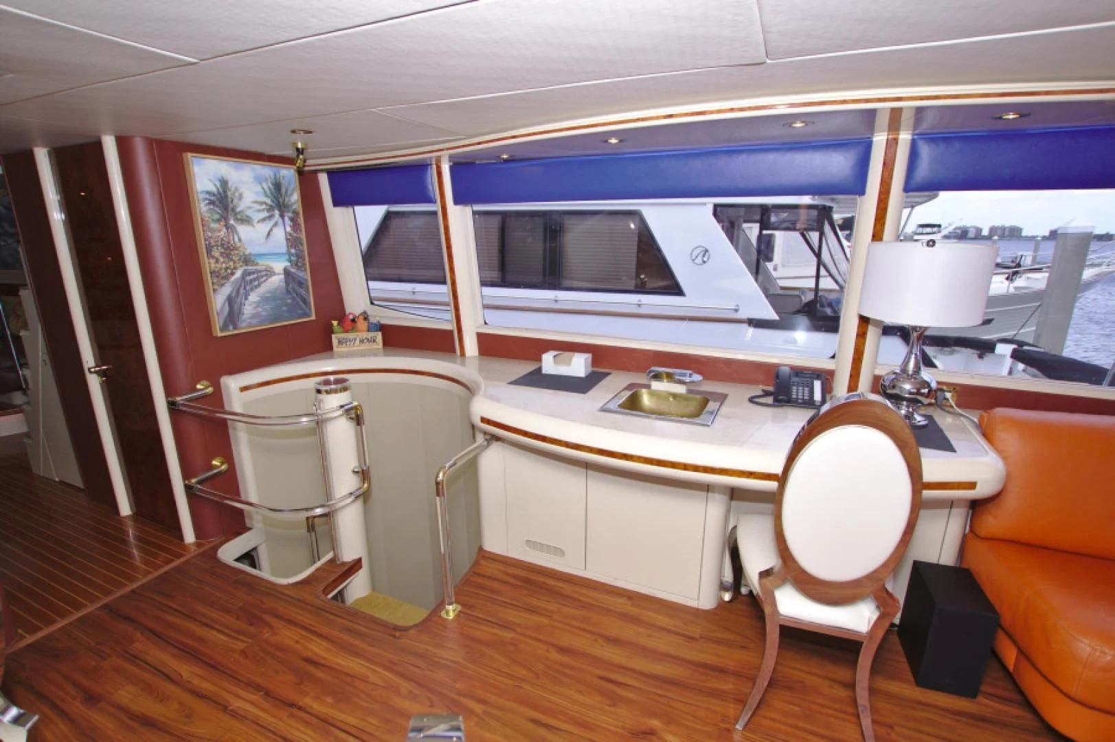 a room with a desk and chairs aboard CHRISTMAS SPIRIT Yacht for Sale