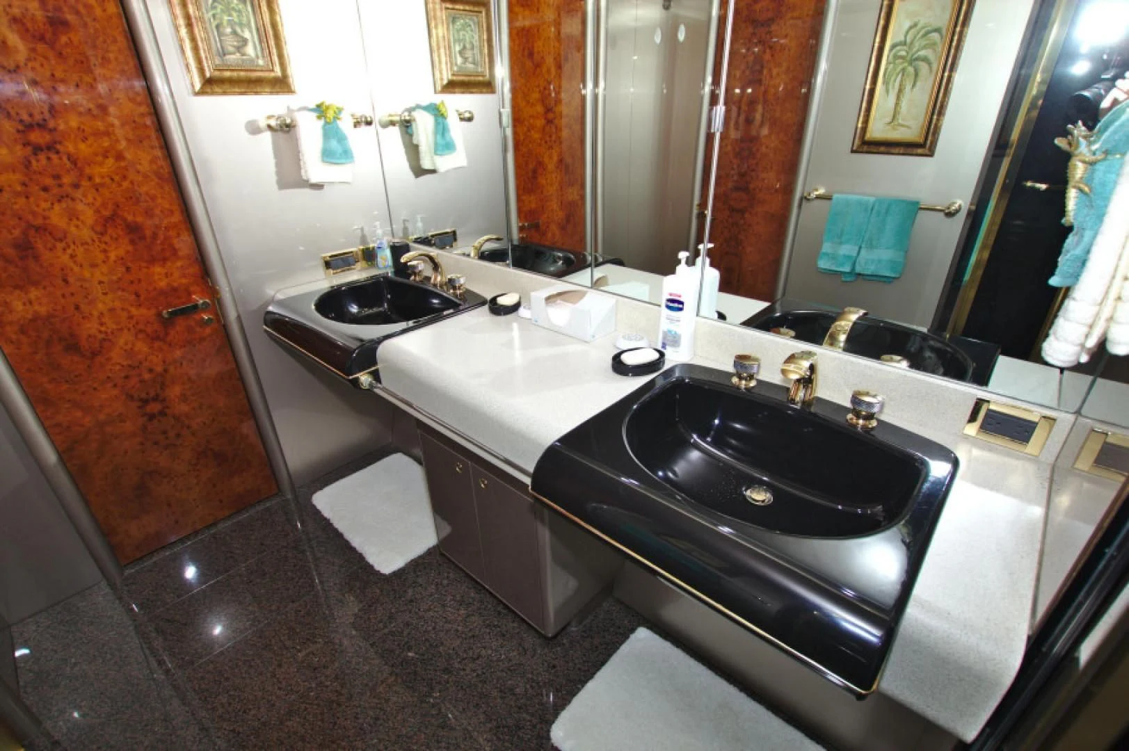 a bathroom with sinks and mirrors aboard CHRISTMAS SPIRIT Yacht for Sale